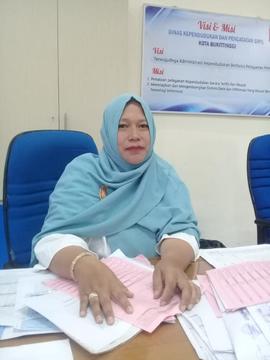 khazanah arsip  foto Kepala  Seksi  Identitas Penduduk Dinas Kependudukan dan Pencatatan Sipil Ko...